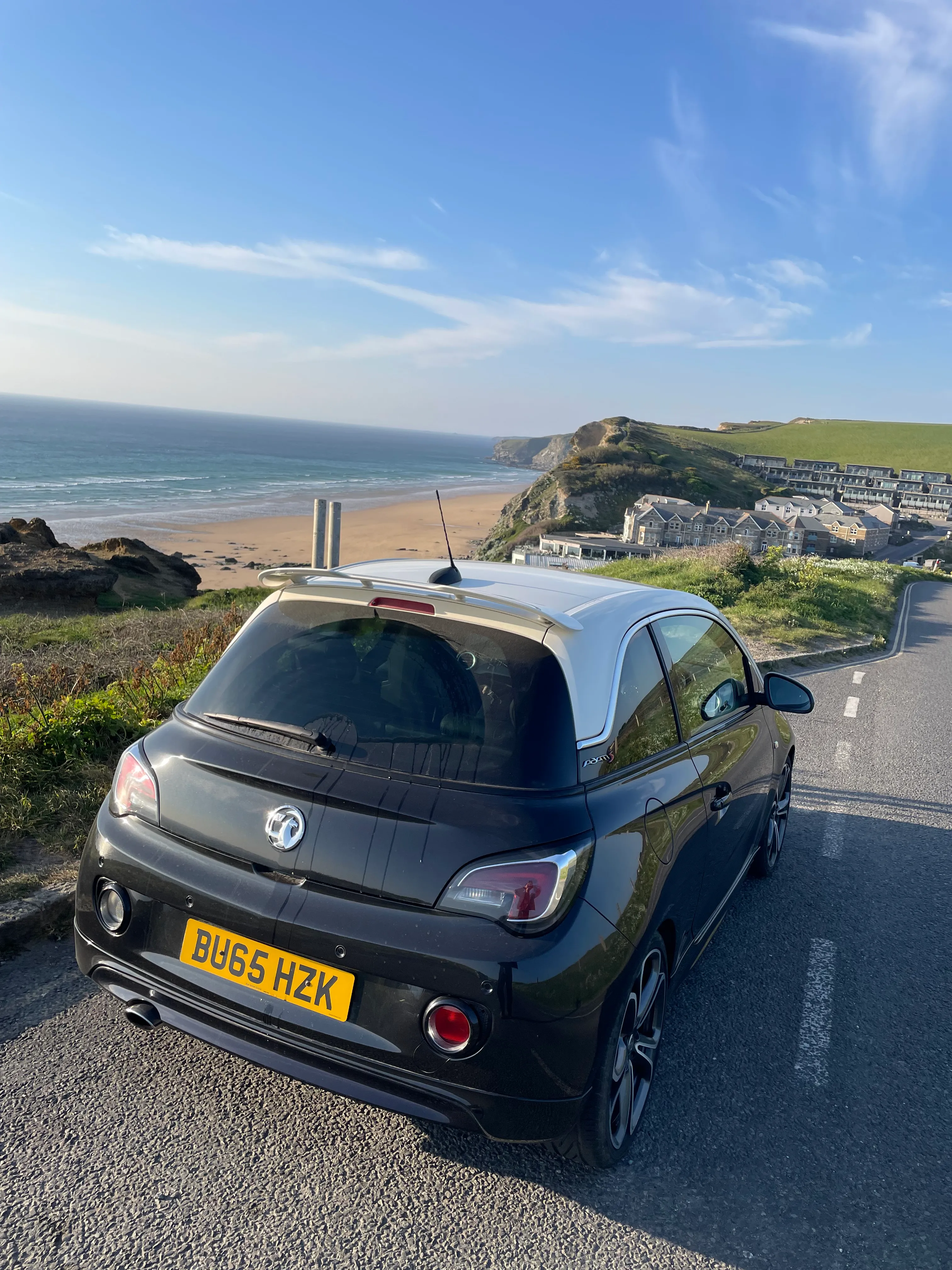 Black Vauxhall Adam S parked above the Cornish coast