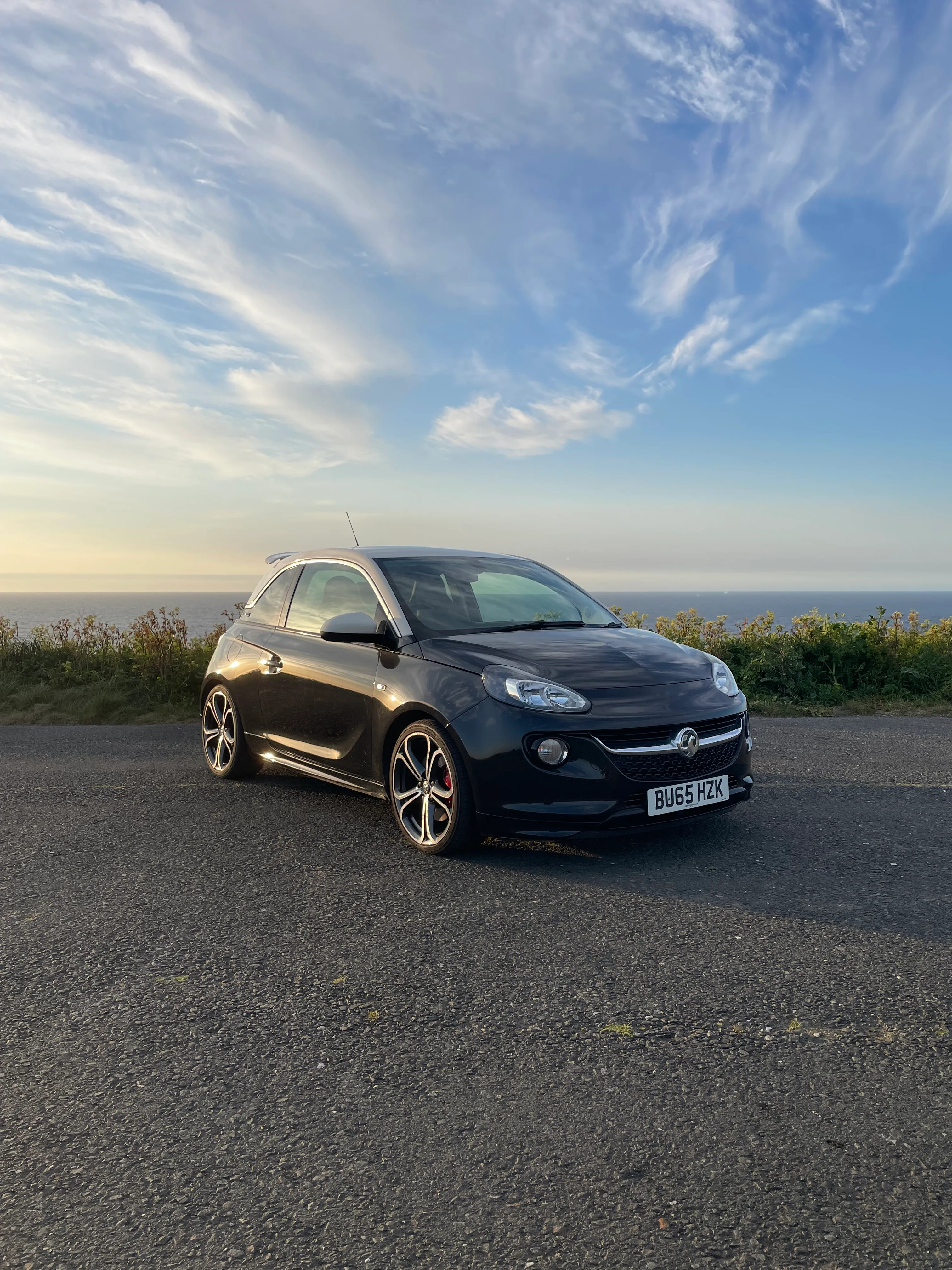Detail shot of the Adam S bodywork at golden hour, photographer in the background